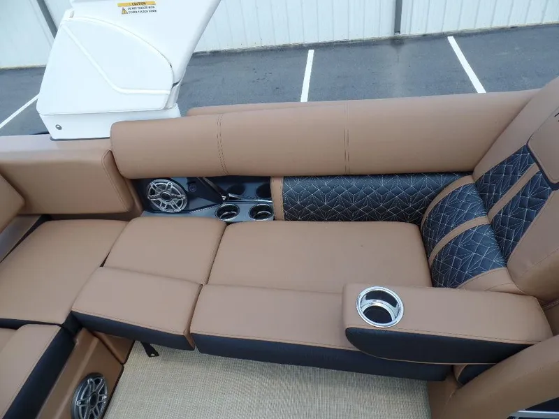 Slide: The Image of Luxurious seating on 2025 Harris Grand Mariner 250 with cup holders and speakers. - 10