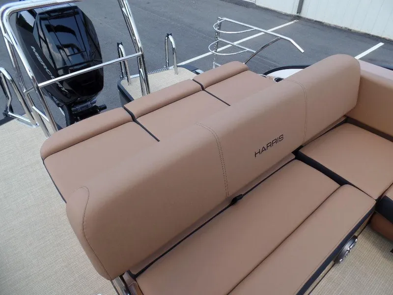 Slide: The Image of 2025 Harris Grand Mariner 250 boat with tan seating and sleek design. - 12