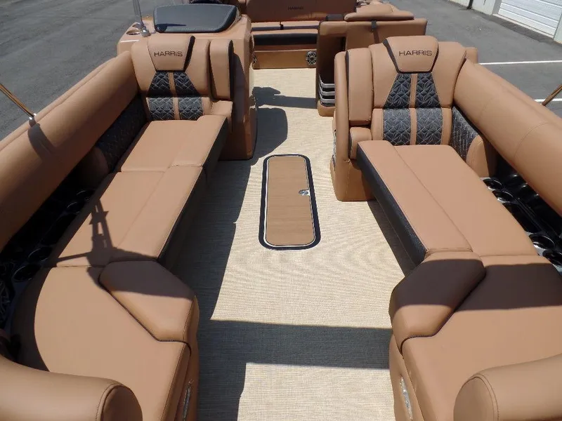 Slide: The Image of 2025 Harris Grand Mariner 250 interior with luxurious tan seating and spacious layout. - 2