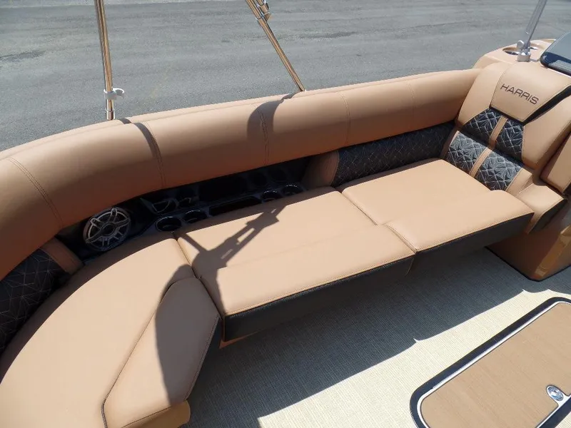 Slide: The Image of 2025 Harris Grand Mariner 250 boat interior with tan leather seating and cup holders. - 3