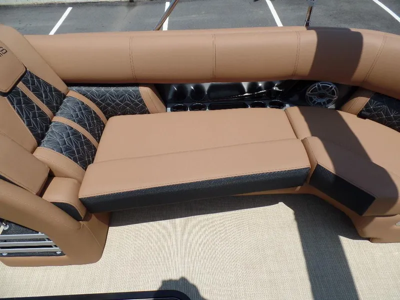 Slide: The Image of Luxurious seating on 2025 Harris Grand Mariner 250 boat, featuring tan and black upholstery. - 4