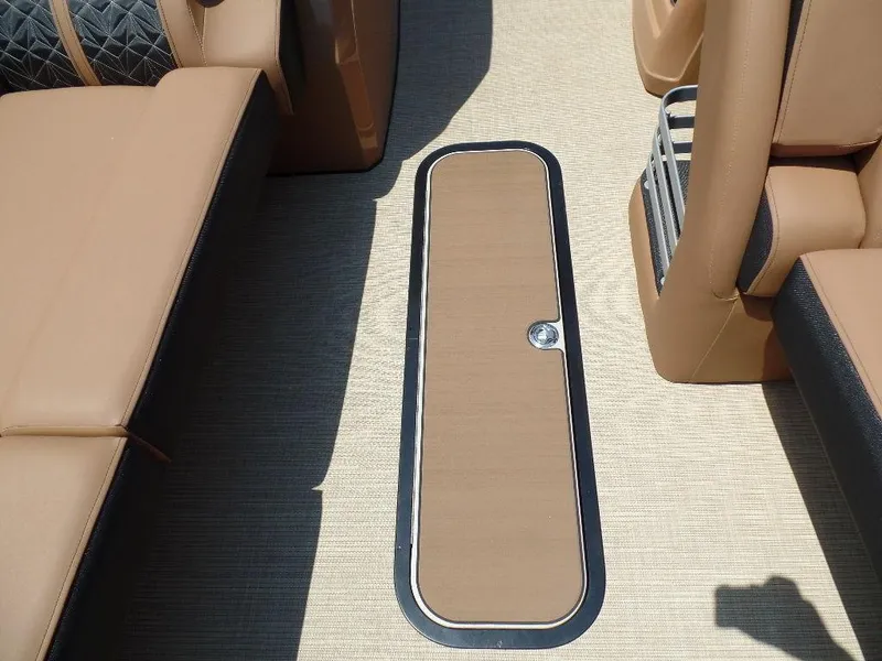 Slide: The Image of Interior of 2025 Harris Grand Mariner 250 boat, featuring tan seating and flooring. - 5