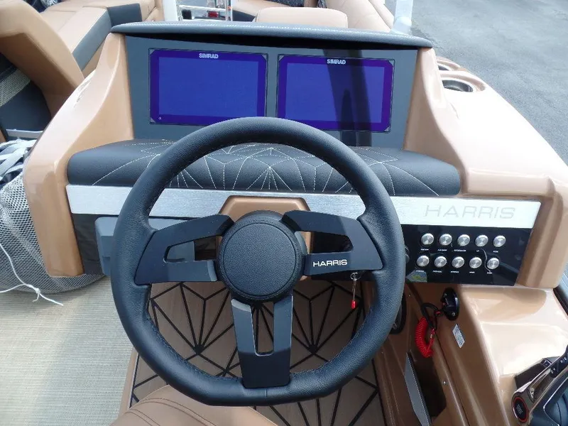 Slide: The Image of 2025 Harris Grand Mariner 250 dashboard with steering wheel and dual screens. - 7