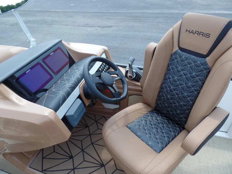 Slide: The Image of 2025 Harris Grand Mariner 250 helm with luxury seating and modern dashboard controls. - 9