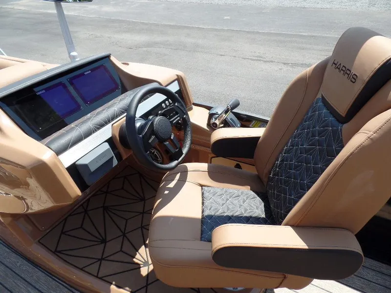 Slide: The Image of 2025 Harris Grand Mariner 250 helm with luxury seating and modern dashboard. - 10