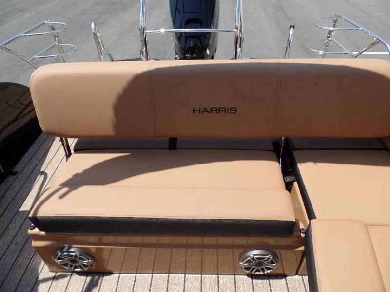 Slide: The Image of 2025 Harris Grand Mariner 250 boat seating with tan upholstery and integrated speakers. - 12