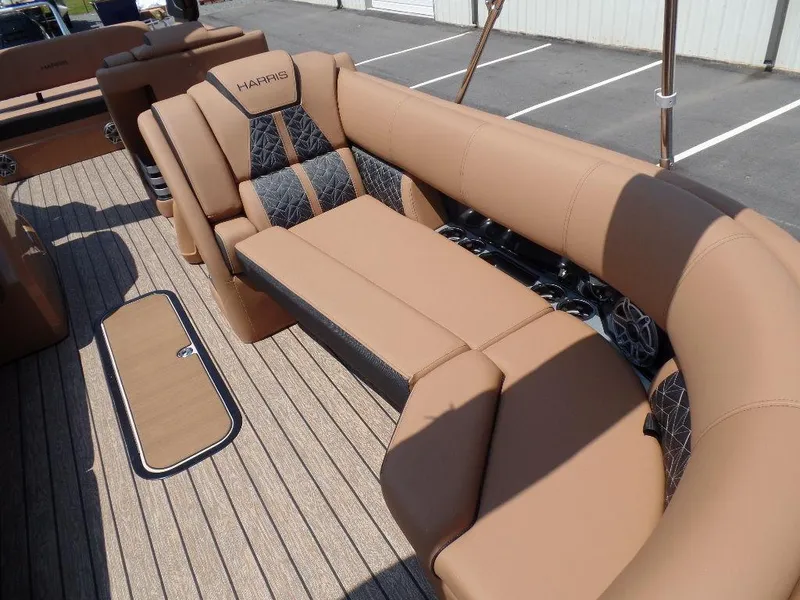 Slide: The Image of 2025 Harris Grand Mariner 250 boat interior with tan and black seating. - 4