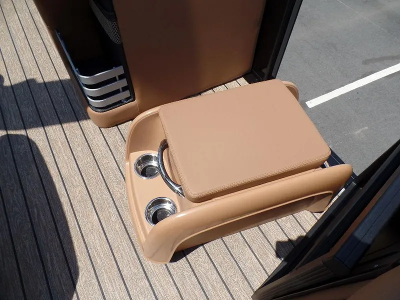 Slide: The Image of 2025 Harris Grand Mariner 250 boat interior with cushioned seat and cup holders. - 8