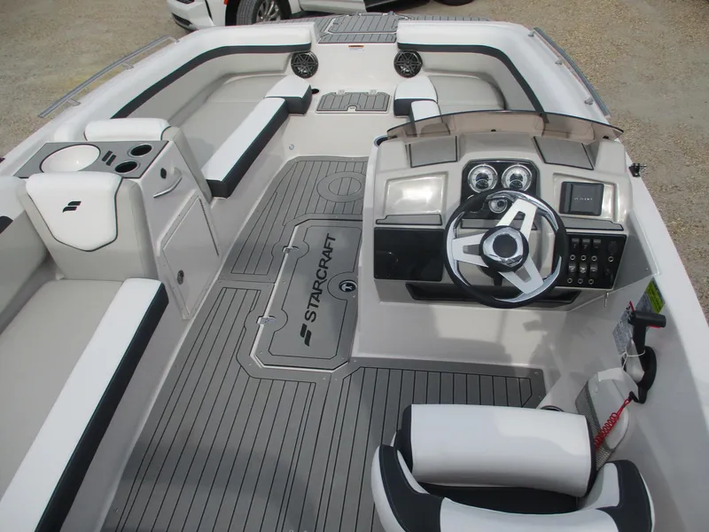 Slide: The Image of 2025 Starcraft SVX191 boat interior with steering wheel and seating. - 10