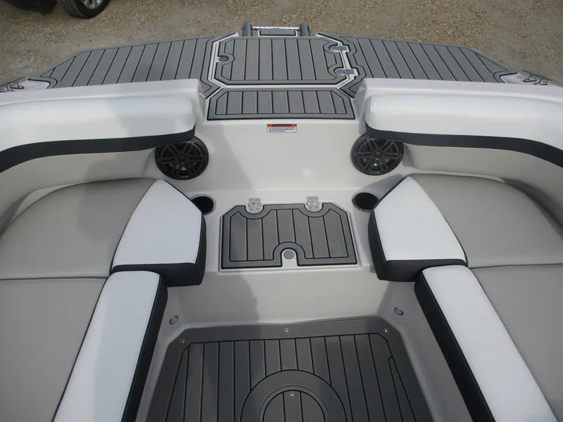 Slide: The Image of 2025 Starcraft SVX191 boat interior with gray and white seating and deck. - 11