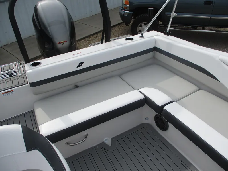 Slide: The Image of 2025 Starcraft SVX191 boat interior with cushioned seating and modern design. - 14