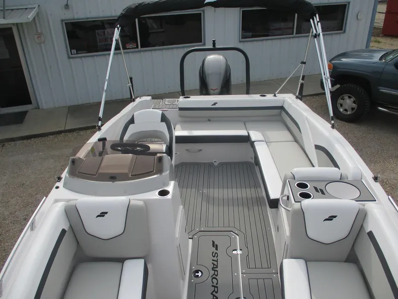 Slide: The Image of 2025 Starcraft SVX191 boat interior with seating and steering console. - 6