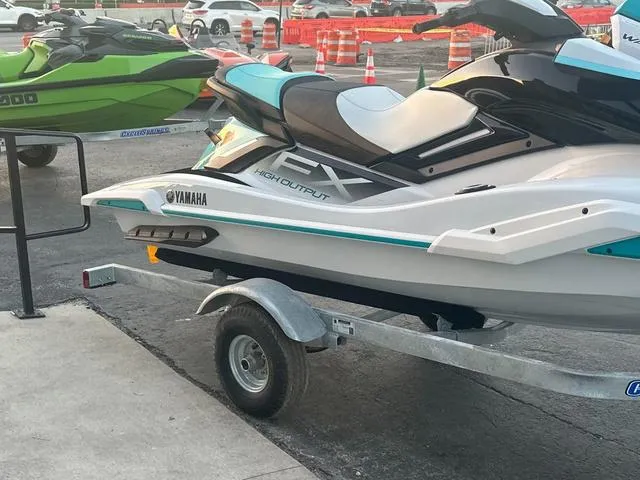 Slide: The Image of 2024 Yamaha Marine Waverunner FX HO in white and black, showcasing sleek design and storage compartment. - 8