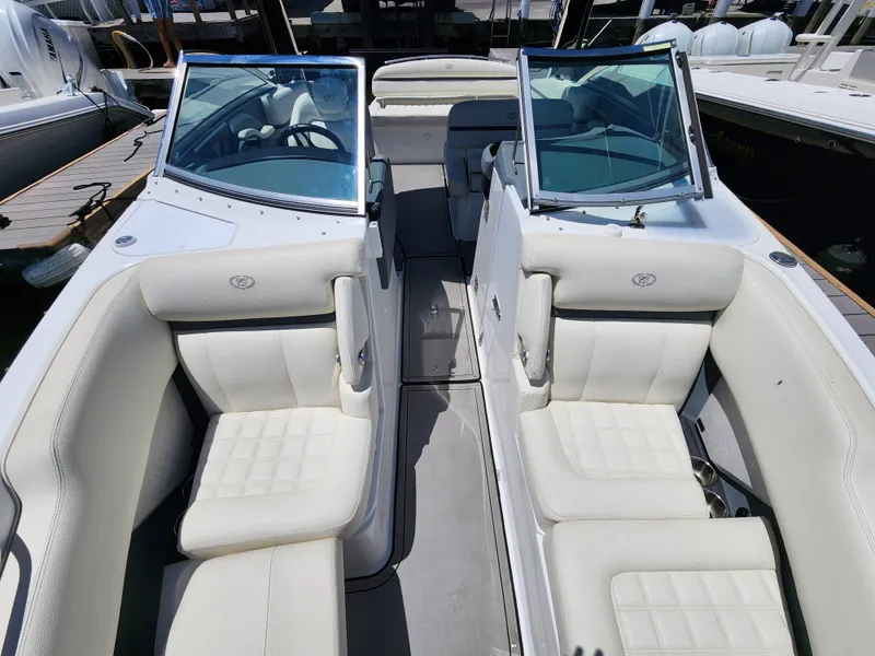 Slide: The Image of 2020 Cobalt R5 boat with white leather seating and open windshield. - 13
