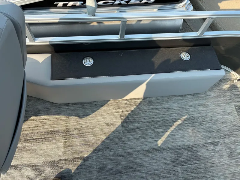 Slide: The Image of 2024 Ranger Reata 220F boat interior with gray flooring and metal railing. - 13