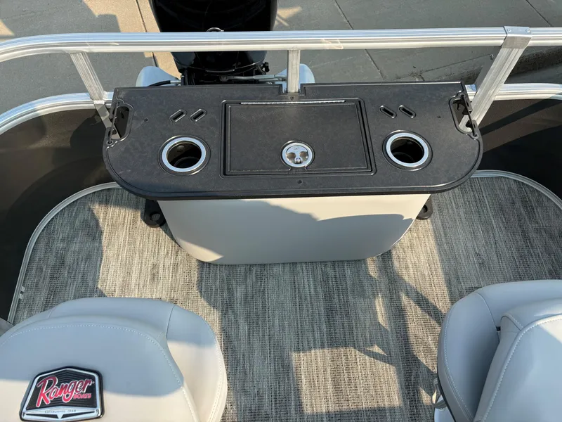 Slide: The Image of 2024 Ranger Reata 220F boat interior with cup holders and seating. - 14