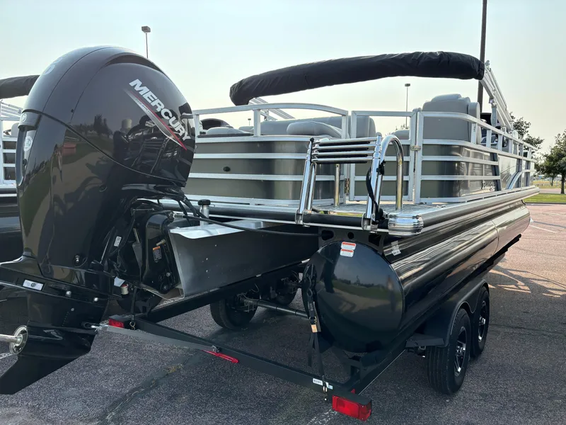 Slide: The Image of 2024 Ranger Reata 220F pontoon boat with Mercury outboard motor. - 3