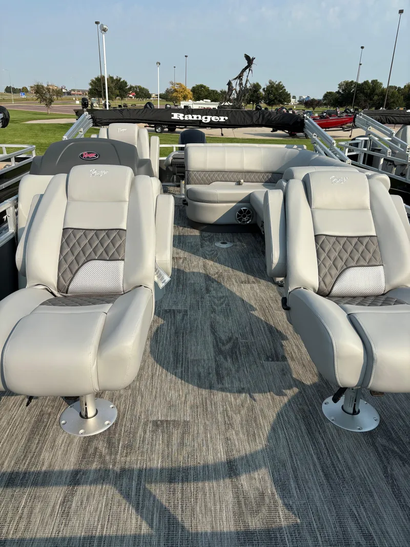 Slide: The Image of 2024 Ranger Reata 220F boat interior with plush seating and modern design. - 5