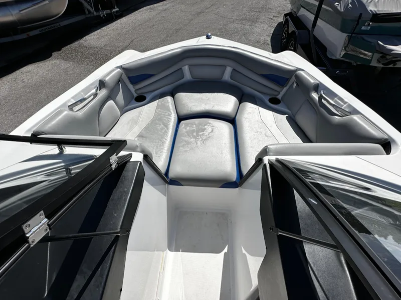 Slide: The Image of 2018 Axis A20 boat interior with gray seating and open bow design. - 28