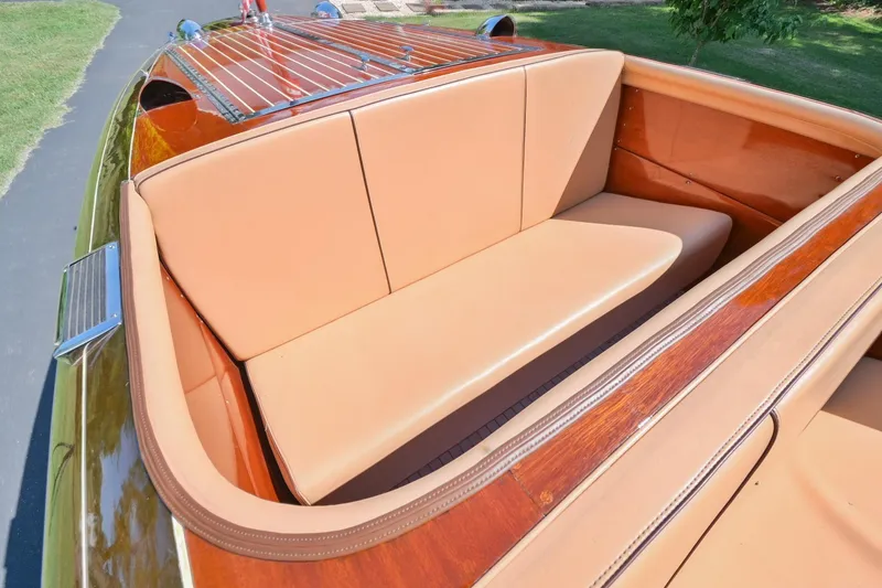 Slide: The Image of 1942 Chris-Craft 17 boat with tan leather seating and wooden deck. - 12