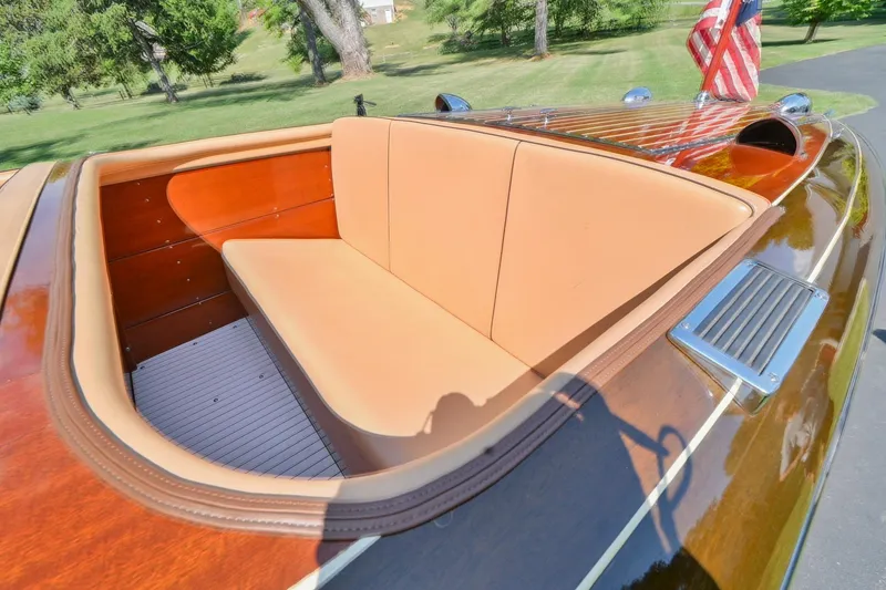 Slide: The Image of 1942 Chris-Craft 17 boat with tan leather seating and wooden finish. - 13
