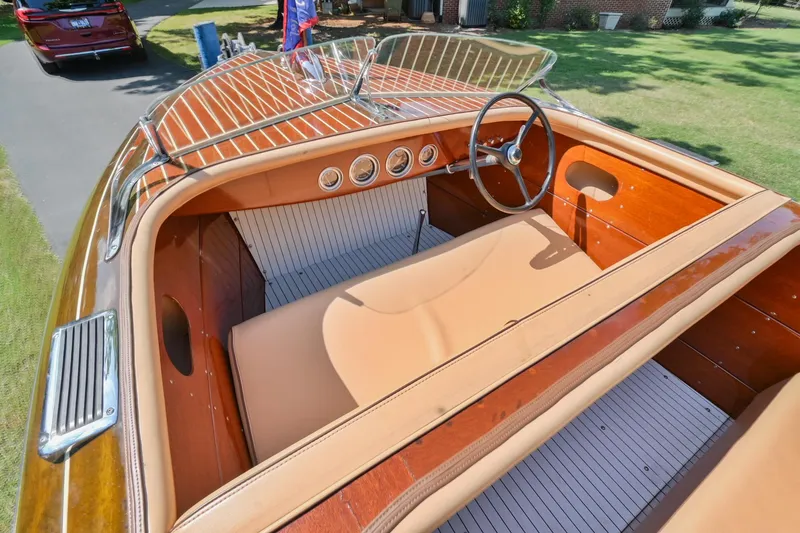 Slide: The Image of 1942 Chris-Craft 17 classic wooden boat interior with tan leather seats and vintage dashboard. - 15