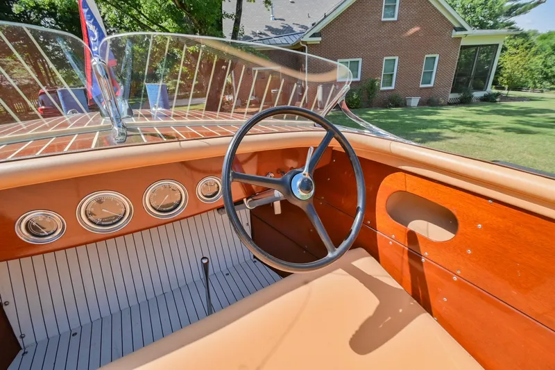 Slide: The Image of 1942 Chris-Craft 17 boat interior with vintage steering wheel and dashboard. - 19