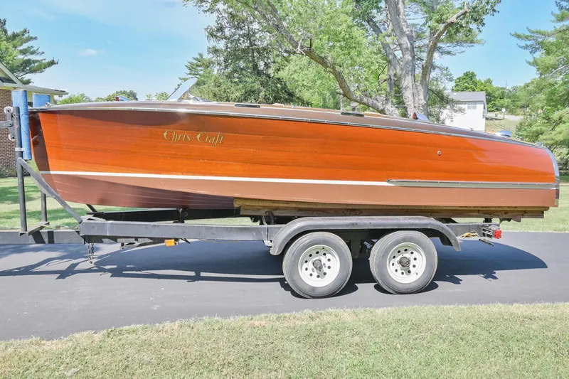 Slide: The Image of 1942 Chris-Craft 17 wooden boat on a trailer, side view. - 2