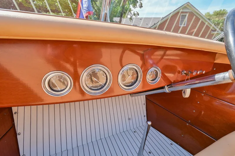 Slide: The Image of 1942 Chris-Craft 17 boat dashboard with vintage gauges and wooden finish. - 20