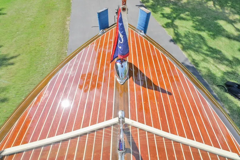 Slide: The Image of 1942 Chris-Craft 17 boat with polished wooden deck and flag. - 24