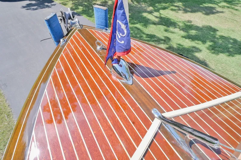 Slide: The Image of 1942 Chris-Craft 17 boat with polished wooden deck and flag. - 25