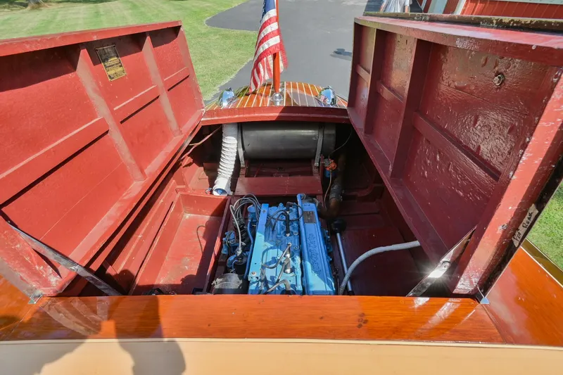 Slide: The Image of 1942 Chris-Craft 17 boat engine compartment with American flag. - 26