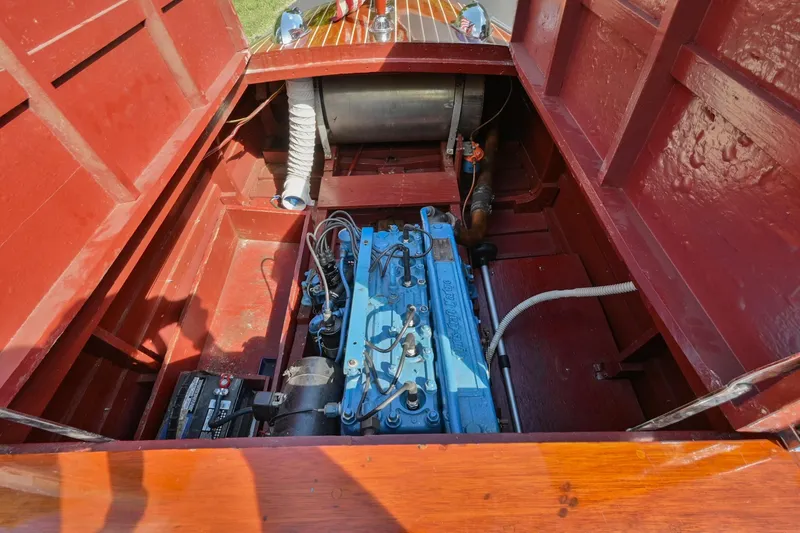 Slide: The Image of 1942 Chris-Craft 17 boat engine compartment with blue engine and red interior. - 27