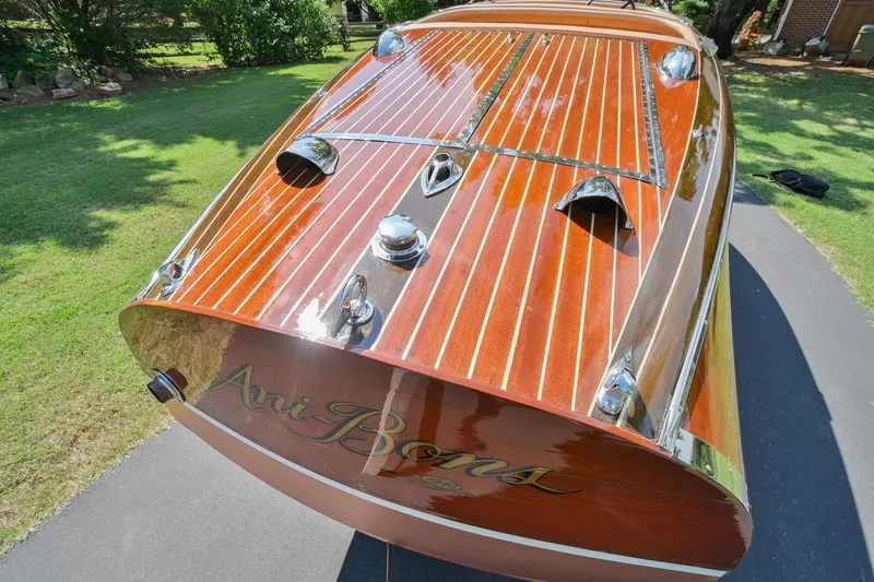 Slide: The Image of 1942 Chris-Craft 17 wooden boat with polished deck and chrome accents. - 8