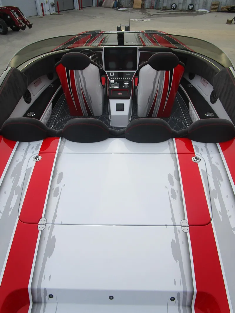 Slide: The Image of 2020 Wright Performance 360 boat interior with red and gray seats and dashboard. - 27