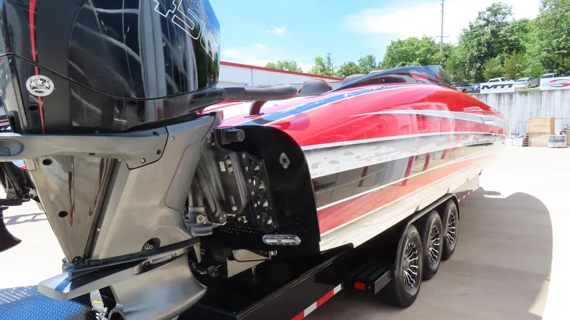 Slide: The Image of 2020 Wright Performance 360 boat with red and silver detailing on a trailer. - 8