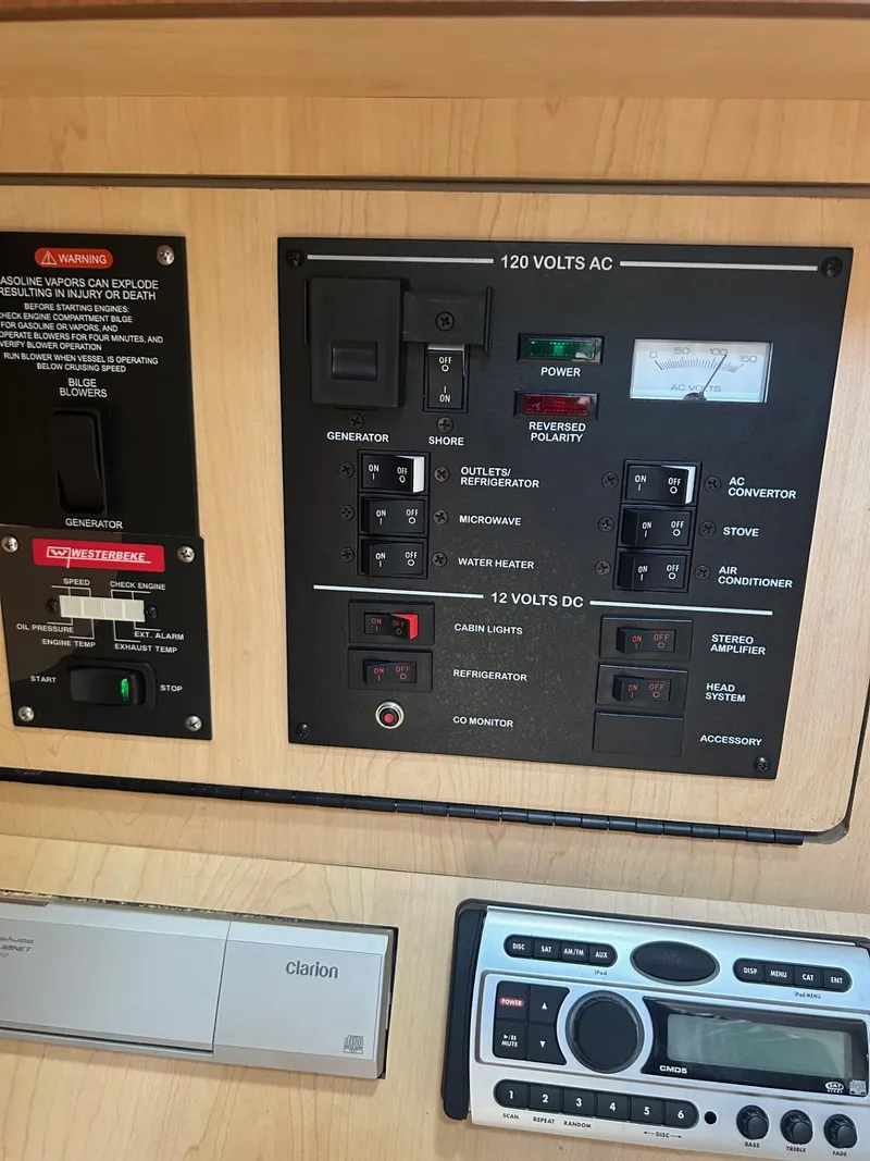 Slide: The Image of Electrical control panel of a 2008 Sea Ray 280DA boat, featuring various switches and a stereo system. - 10