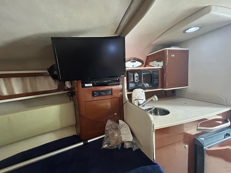 Slide: The Image of Interior of 2008 Sea Ray 280DA boat with TV, kitchenette, and microwave. - 12
