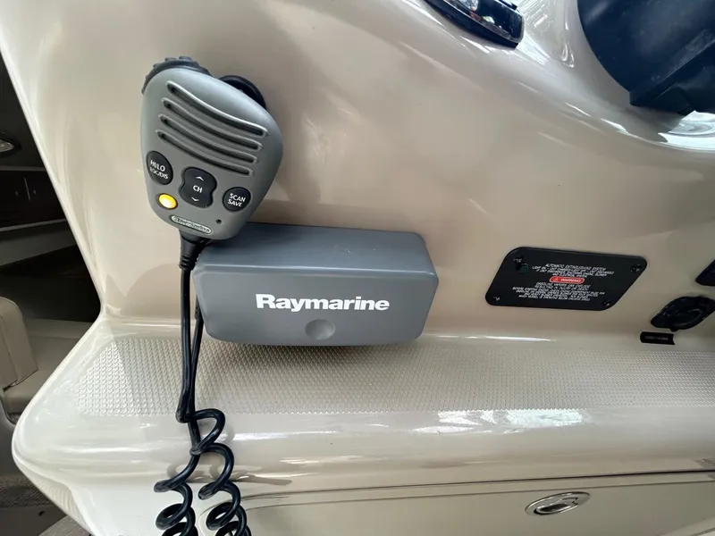 Slide: The Image of Raymarine radio system on 2008 Sea Ray 280DA boat dashboard. - 4