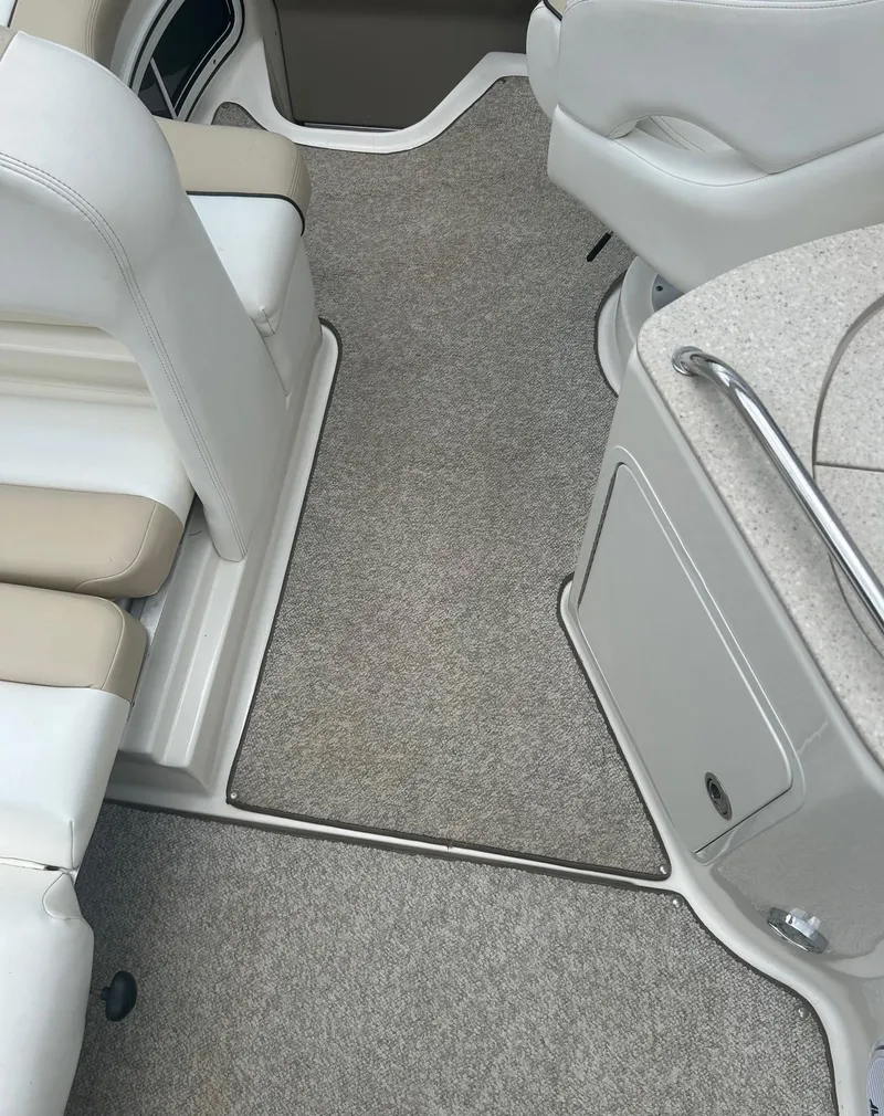 Slide: The Image of Interior of a 2008 Sea Ray 280DA boat with beige seating and carpeted flooring. - 8