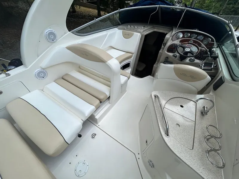 Slide: The Image of 2008 Sea Ray 280 Sundancer boat interior with helm, seating, and control panel. - 7