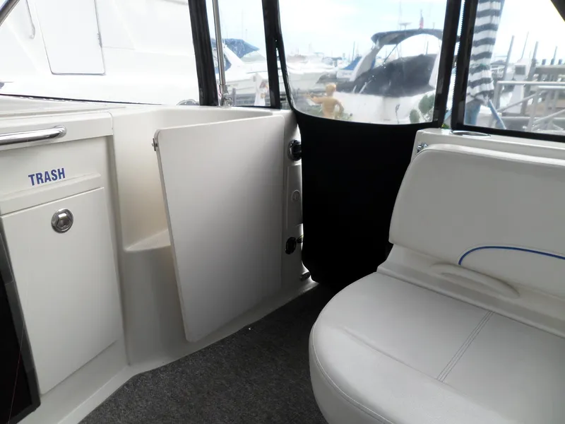Slide: The Image of Interior of 2008 Bayliner 320 Express boat with seating and storage. - 27