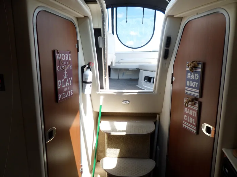 Slide: The Image of Interior of 2008 Bayliner 320 Express boat with cabin doors and steps leading to deck. - 37
