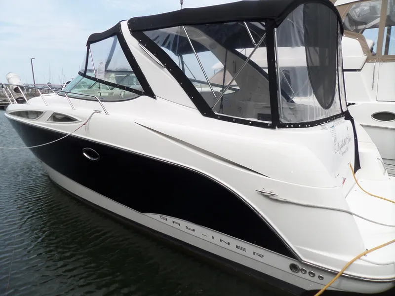 Slide: The Image of 2008 Bayliner 320 Express boat docked in marina. - 4