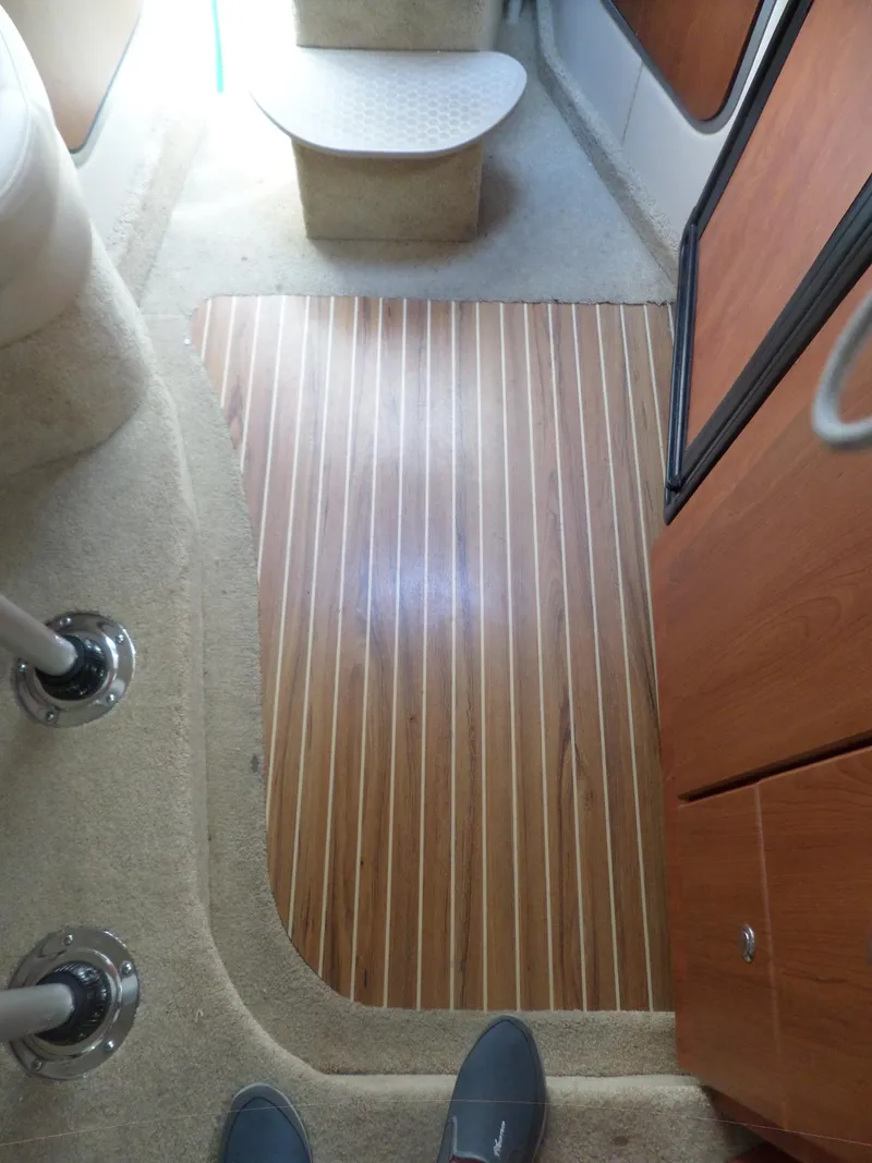 Slide: The Image of Interior of 2008 Bayliner 320 Express with wood flooring and carpet. - 40