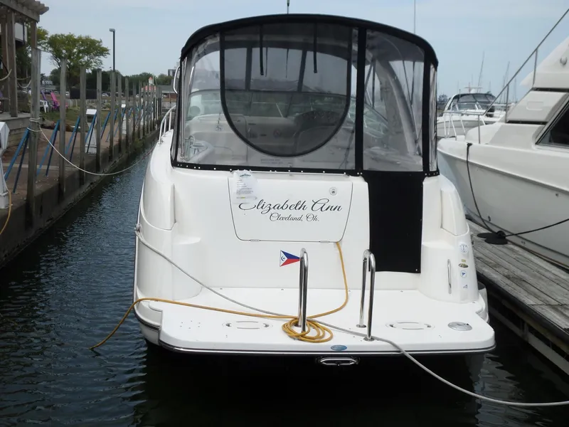 Slide: The Image of 2008 Bayliner 320 Express docked, rear view with canopy and name "Elizabeth Ann." - 8
