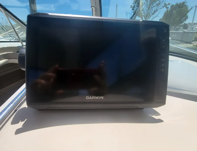 Slide: The Image of Garmin device on 1999 Sea Ray 290 Sundancer boat dashboard. - 28