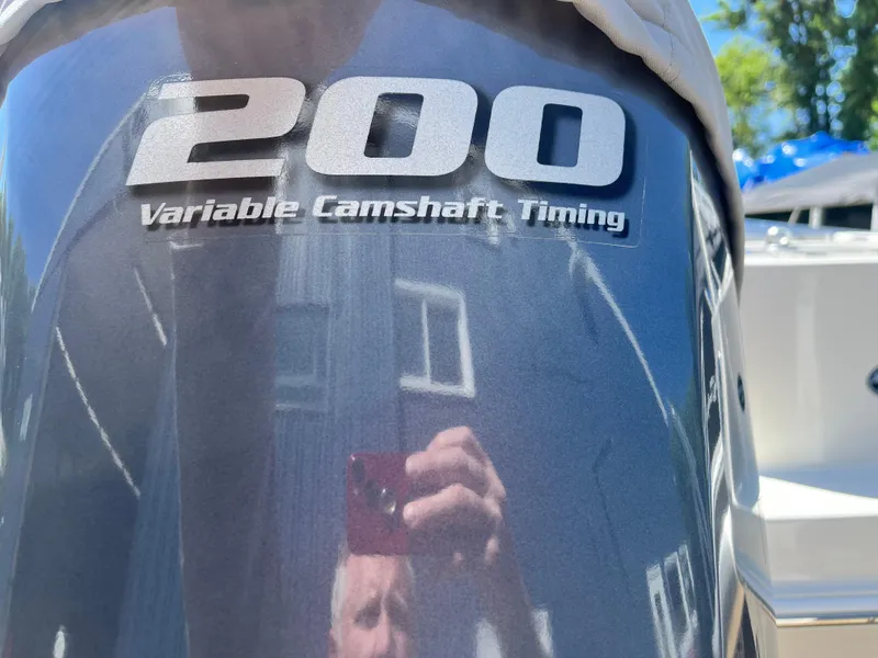 Slide: The Image of Outboard motor with "200 Variable Camshaft Timing" label on a 2015 Sailfish 220 boat. - 10