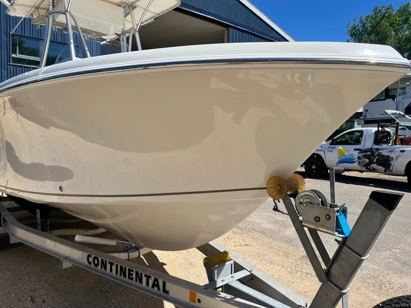 Slide: The Image of 2015 Sailfish 220 boat on Continental trailer, parked outdoors. - 12