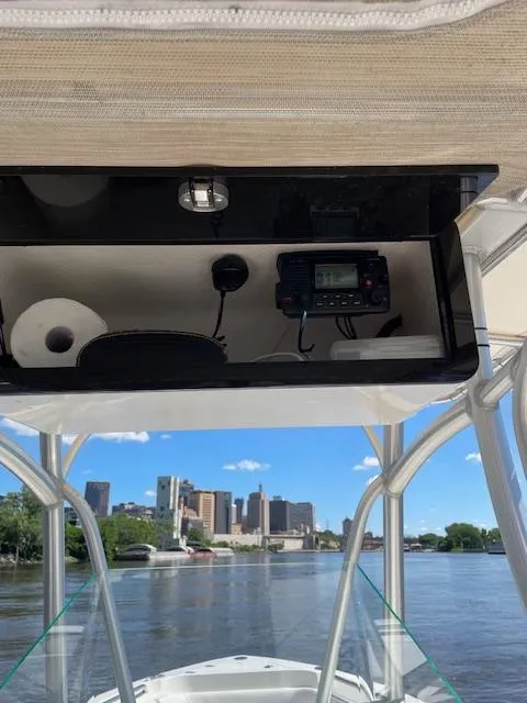 Slide: The Image of 2015 Sailfish 220 boat console with city skyline in the background. - 5